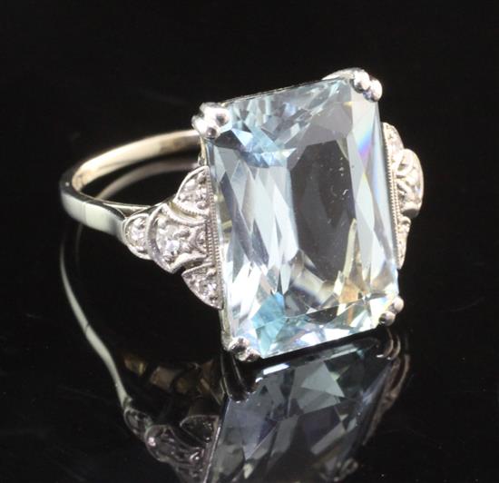 A white gold, aquamarine and diamond set dress ring, size O.